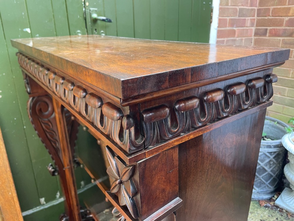 Early C19th George IV period carved rosewood glazed bookcase or pier cabinet of bold design .  View XVIII
