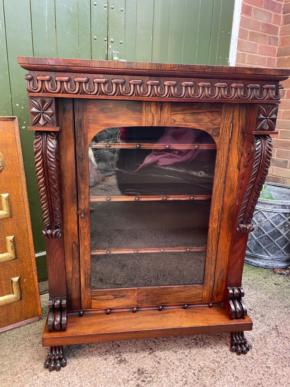 Early C19th George IV period carved rosewood glazed bookcase or pier cabinet of bold design .  View XIX