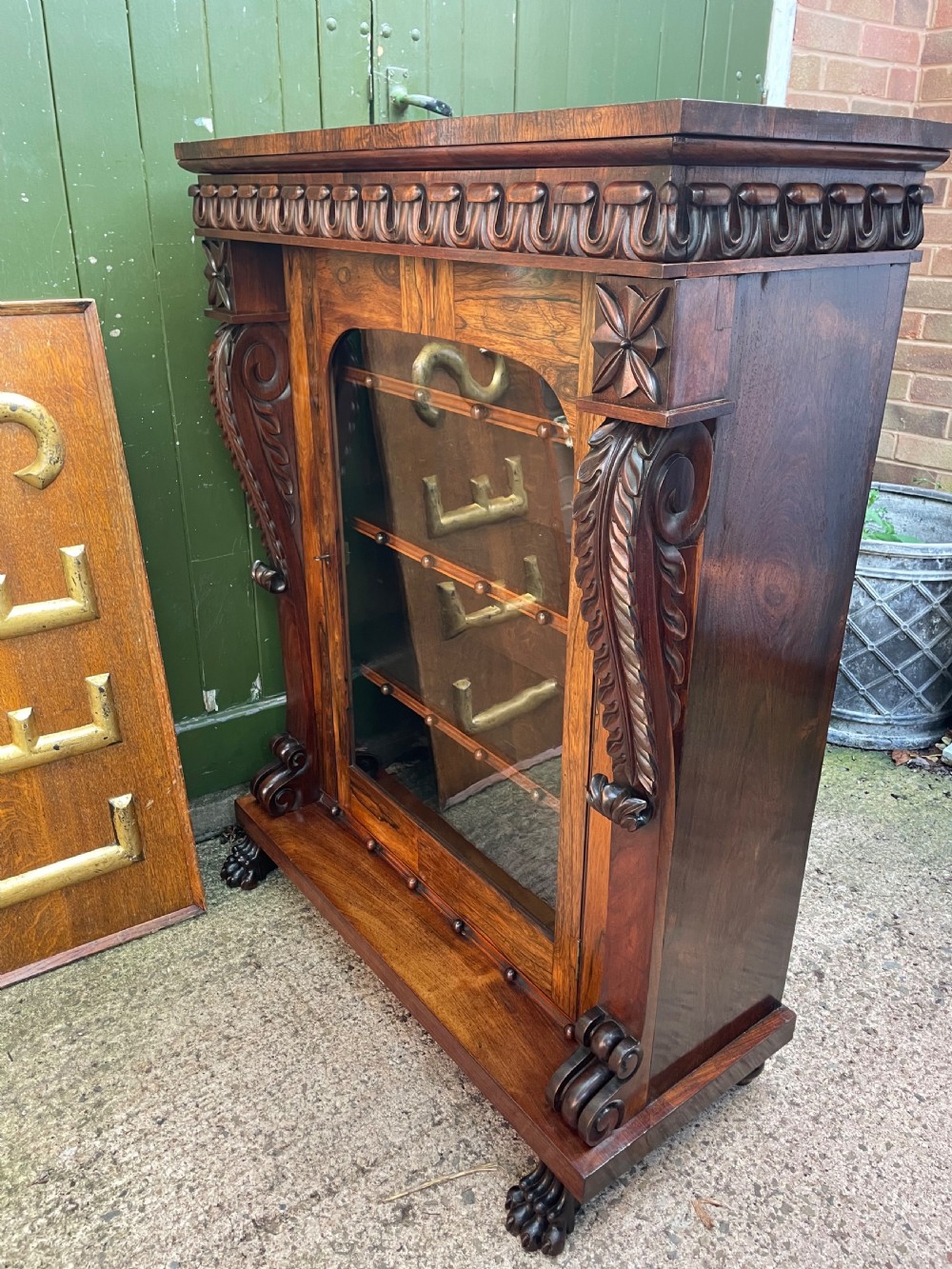 Early C19th George IV period carved rosewood glazed bookcase or pier cabinet of bold design .  View XX