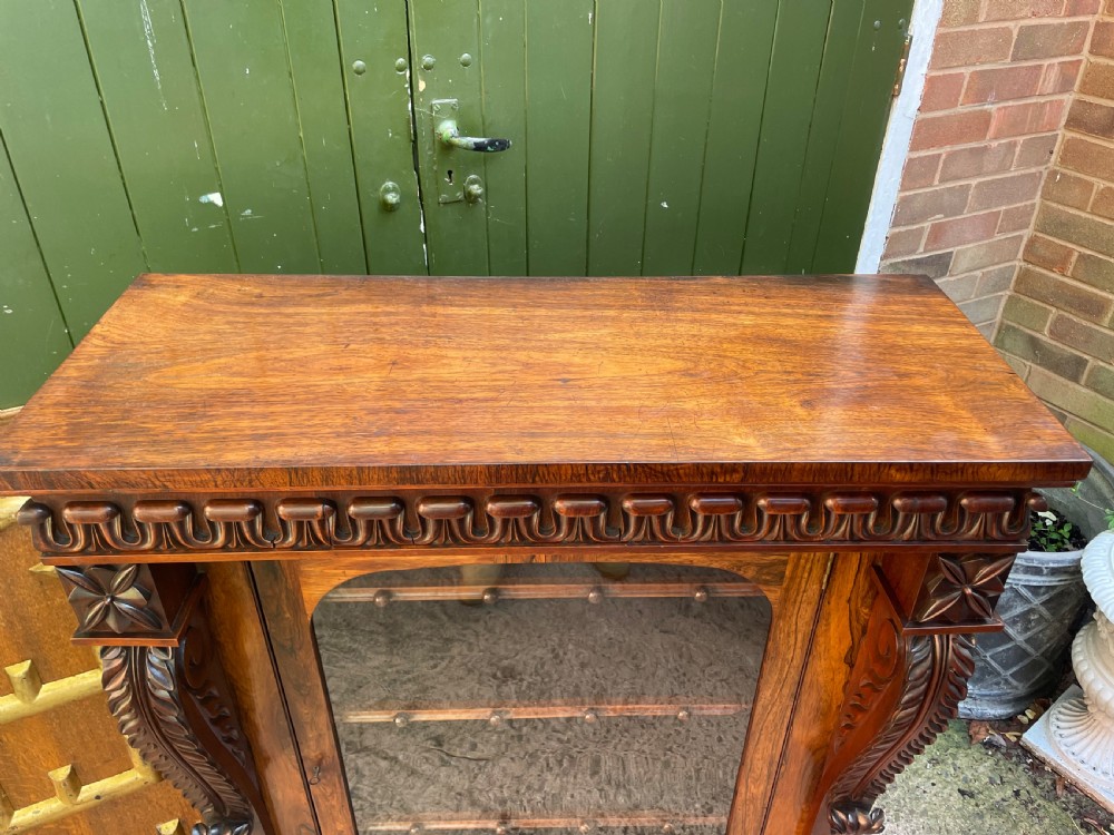 Early C19th George IV period carved rosewood glazed bookcase or pier cabinet of bold design .  View XXII