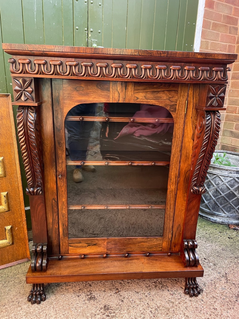 Early C19th George IV period carved rosewood glazed bookcase or pier cabinet of bold design .  View XXIII