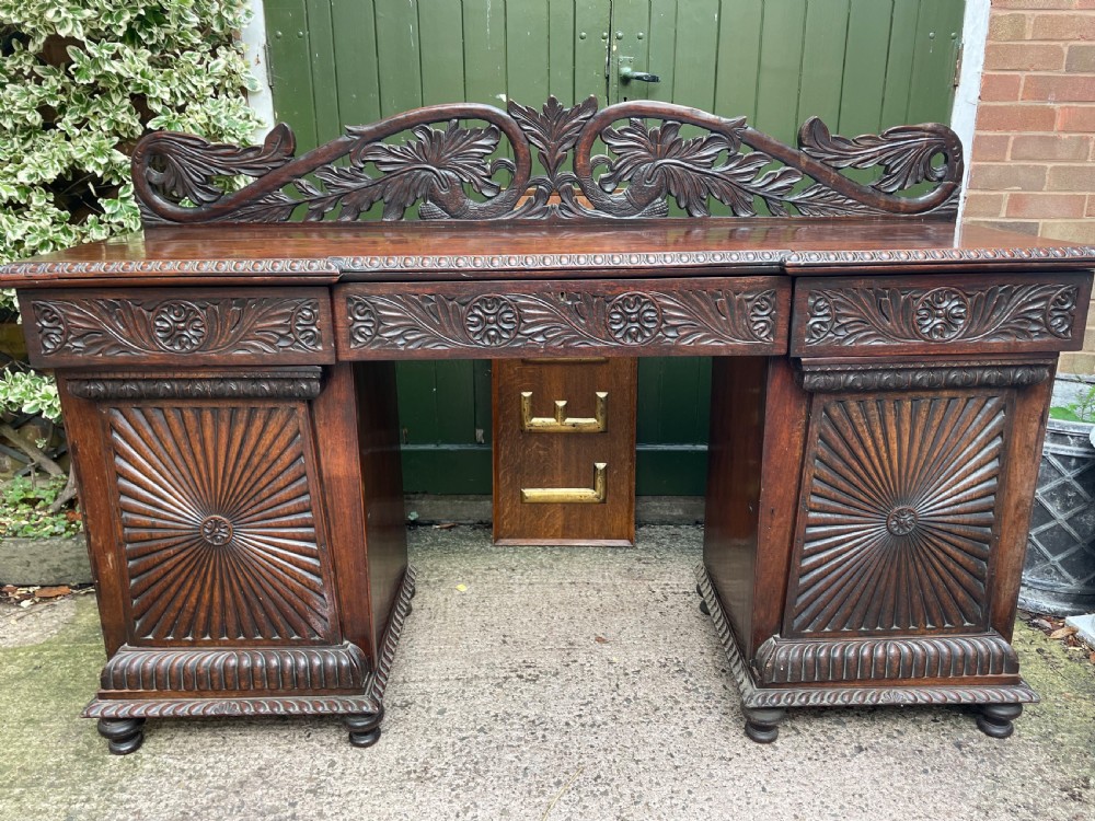 C19th Anglo-Indian carved padauk pedestal sideboard.