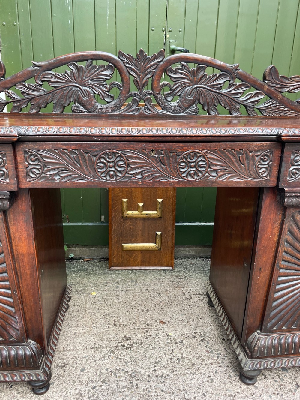 C19th Anglo-Indian carved padauk pedestal sideboard. View IV