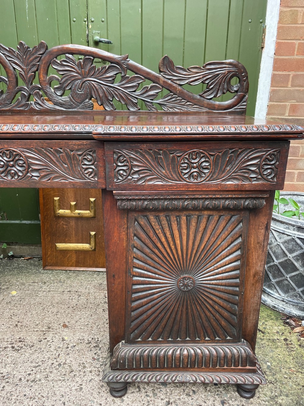 C19th Anglo-Indian carved padauk pedestal sideboard. View V