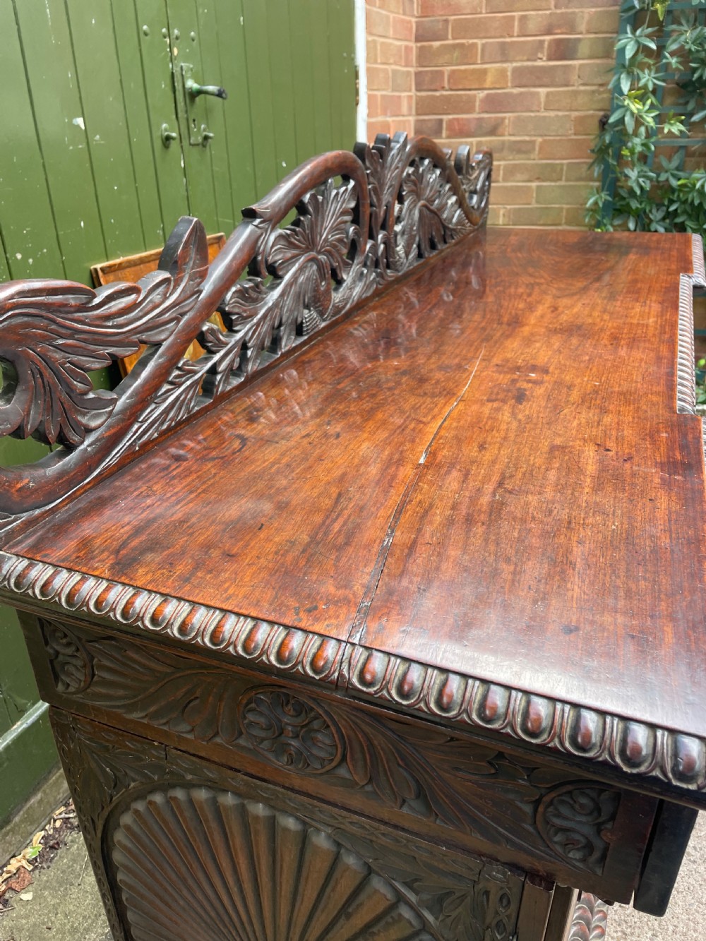 C19th Anglo-Indian carved padauk pedestal sideboard. View VI