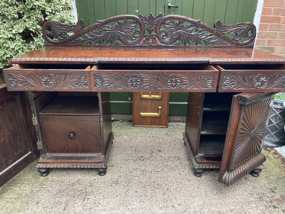 C19th Anglo-Indian carved padauk pedestal sideboard. View IX