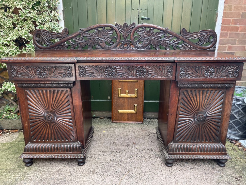 C19th Anglo-Indian carved padauk pedestal sideboard. View XXI