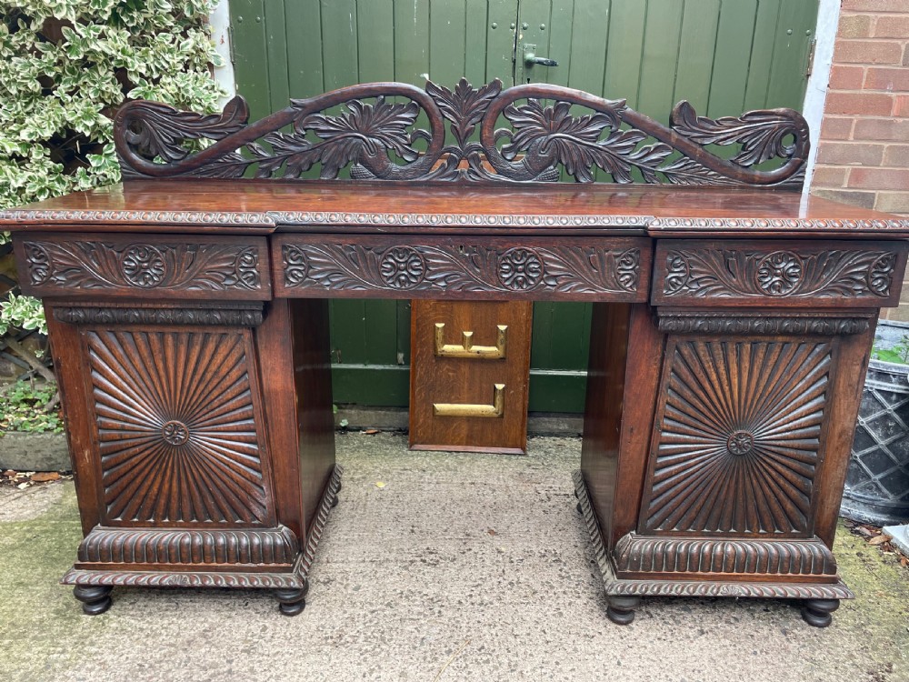 C19th Anglo-Indian carved padauk pedestal sideboard. View XXII