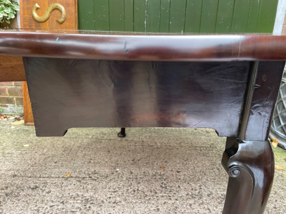 A mid-18th century George II Cuban mahogany drop-leaf table featuring an oval top, cabriole legs, and pad feet. View X