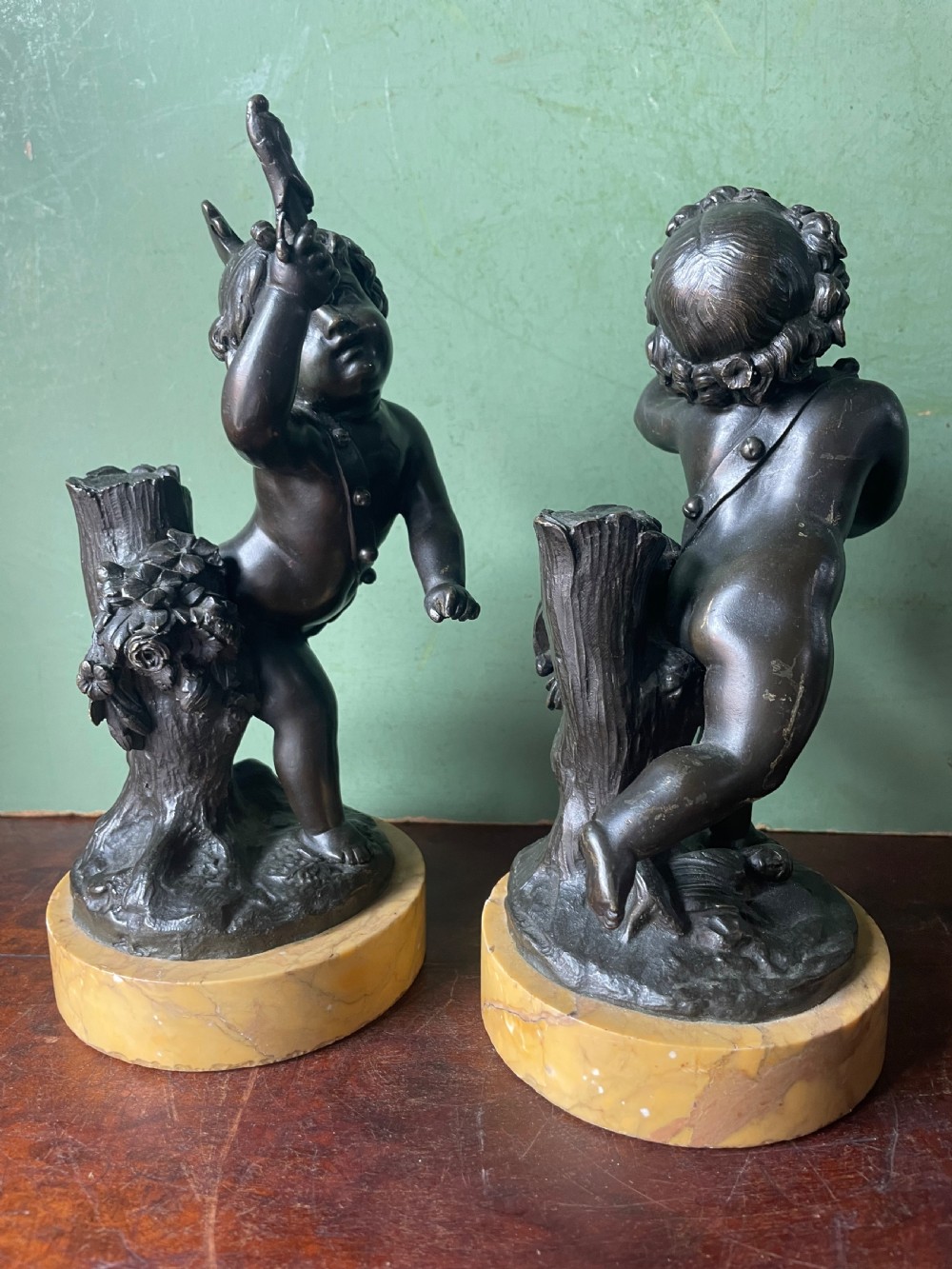 Pair of early C19th French bronze allegorical sculptures of cherubs , emblematic of music and comedy after Clodion.
 View III