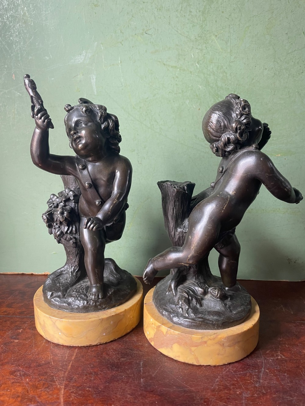 Pair of early C19th French bronze allegorical sculptures of cherubs , emblematic of music and comedy after Clodion.
 View IV