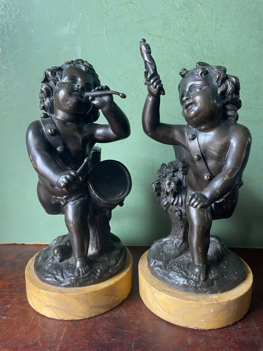 Pair of early C19th French bronze allegorical sculptures of cherubs , emblematic of music and comedy after Clodion.
 View V