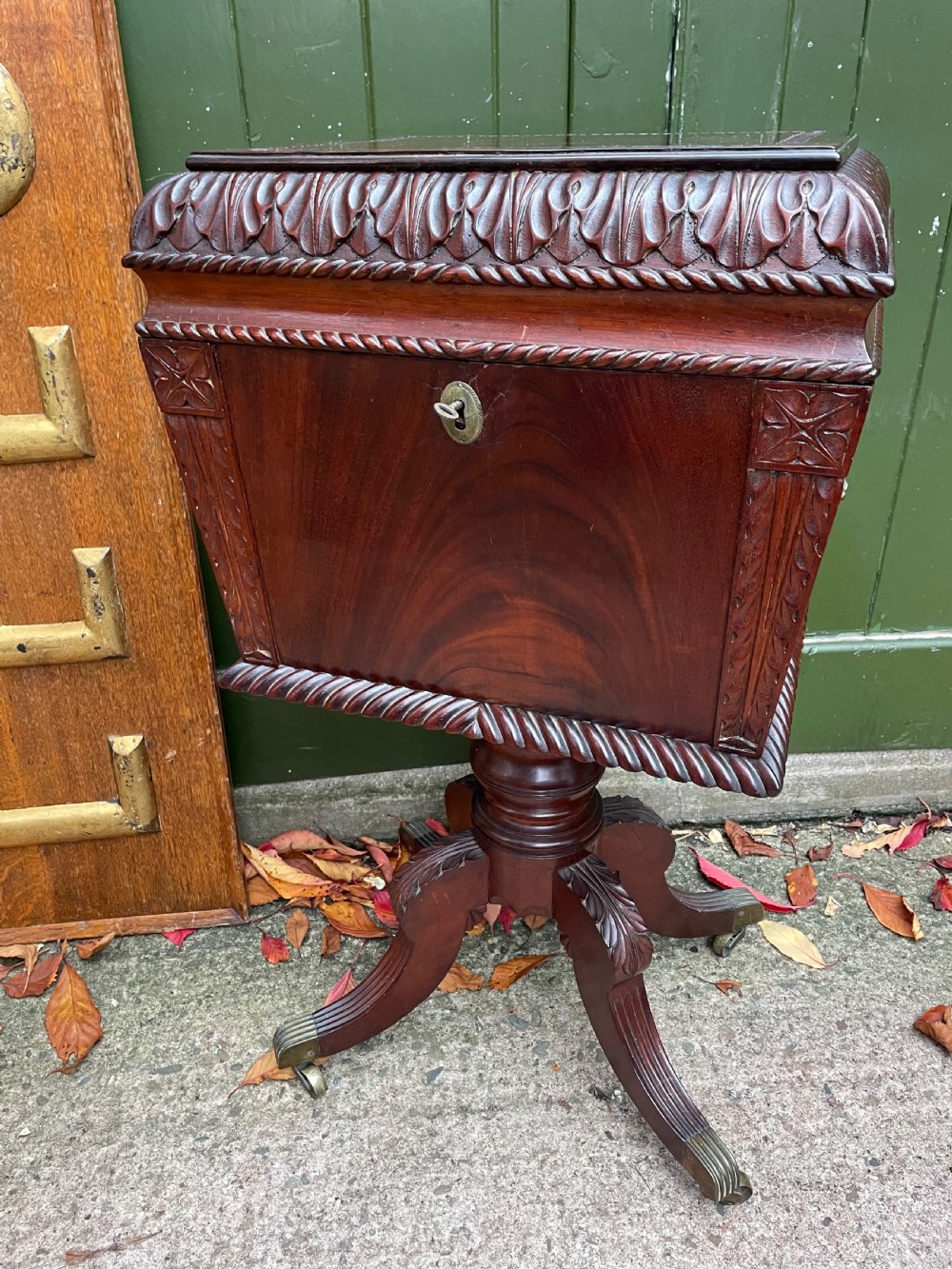 Early C19th Regency period Irish carved mahogany cellarette.