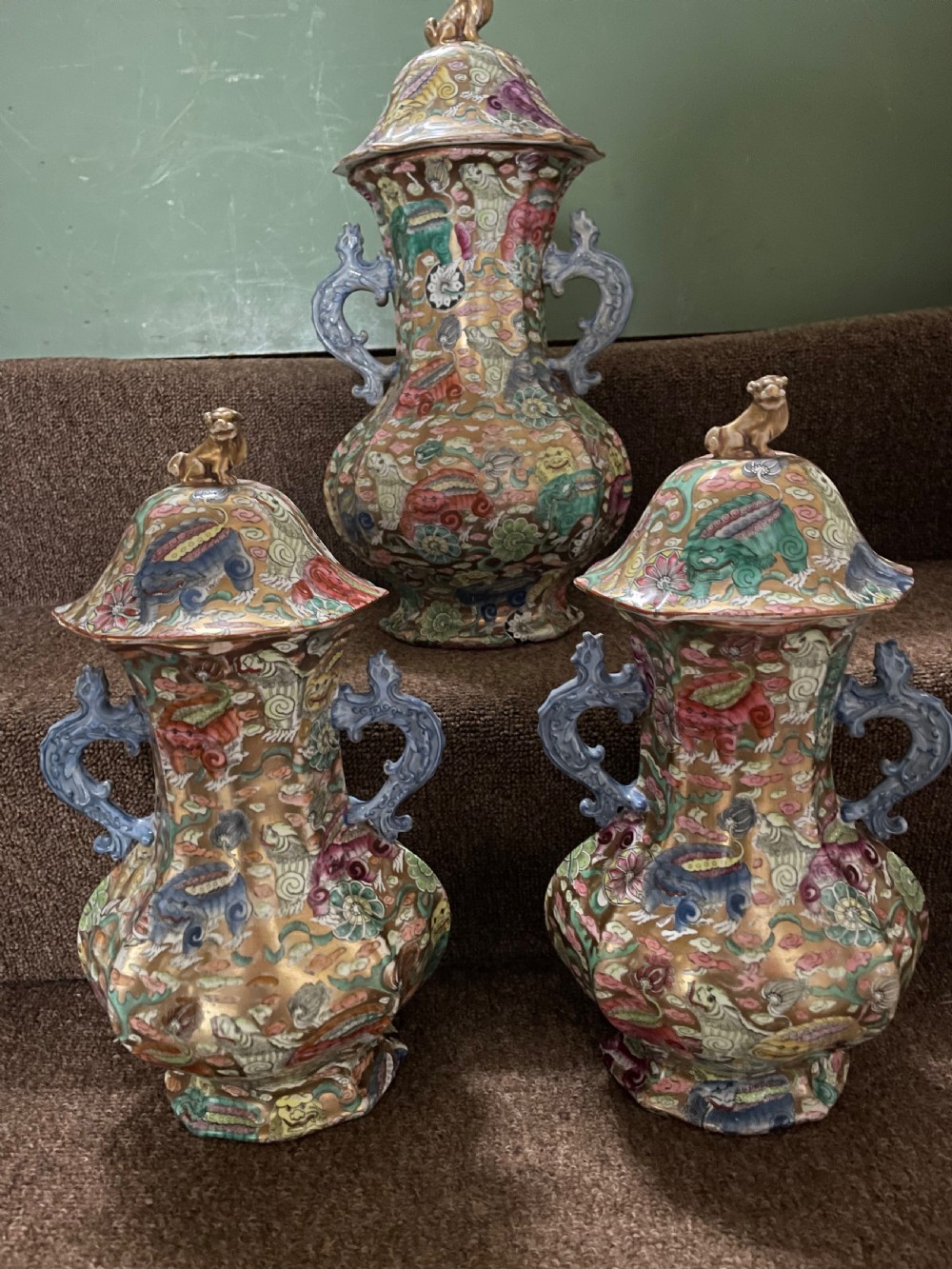 A three-piece nineteenth-century Masons Ironstone garniture set decorated with Chinoiserie enamel patterns, blue handles, and lion lid finials. View II