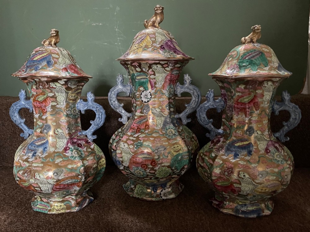 A three-piece nineteenth-century Masons Ironstone garniture set decorated with Chinoiserie enamel patterns, blue handles, and lion lid finials. View III