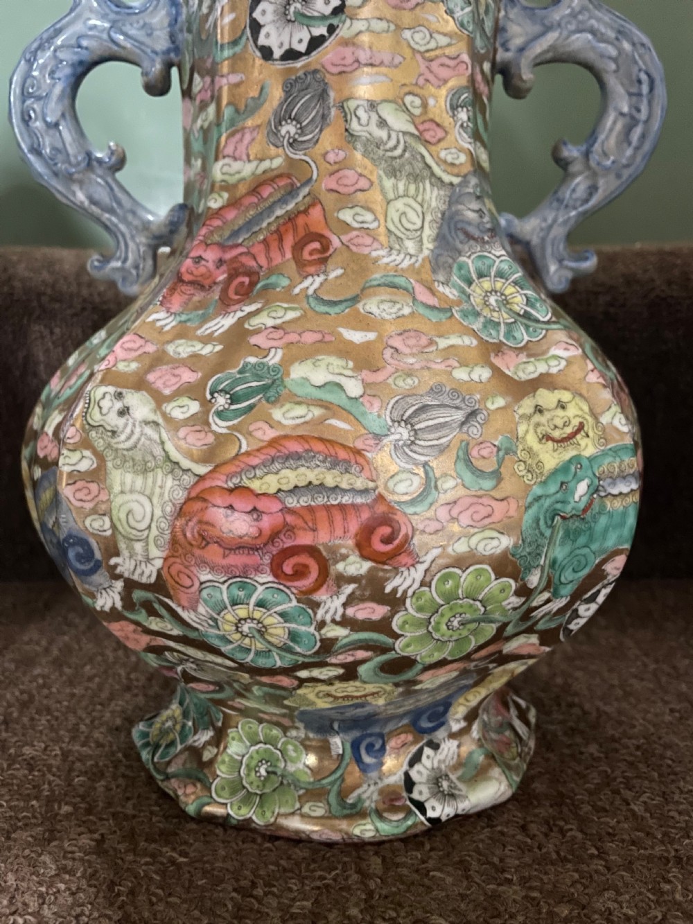 A three-piece nineteenth-century Masons Ironstone garniture set decorated with Chinoiserie enamel patterns, blue handles, and lion lid finials. View V