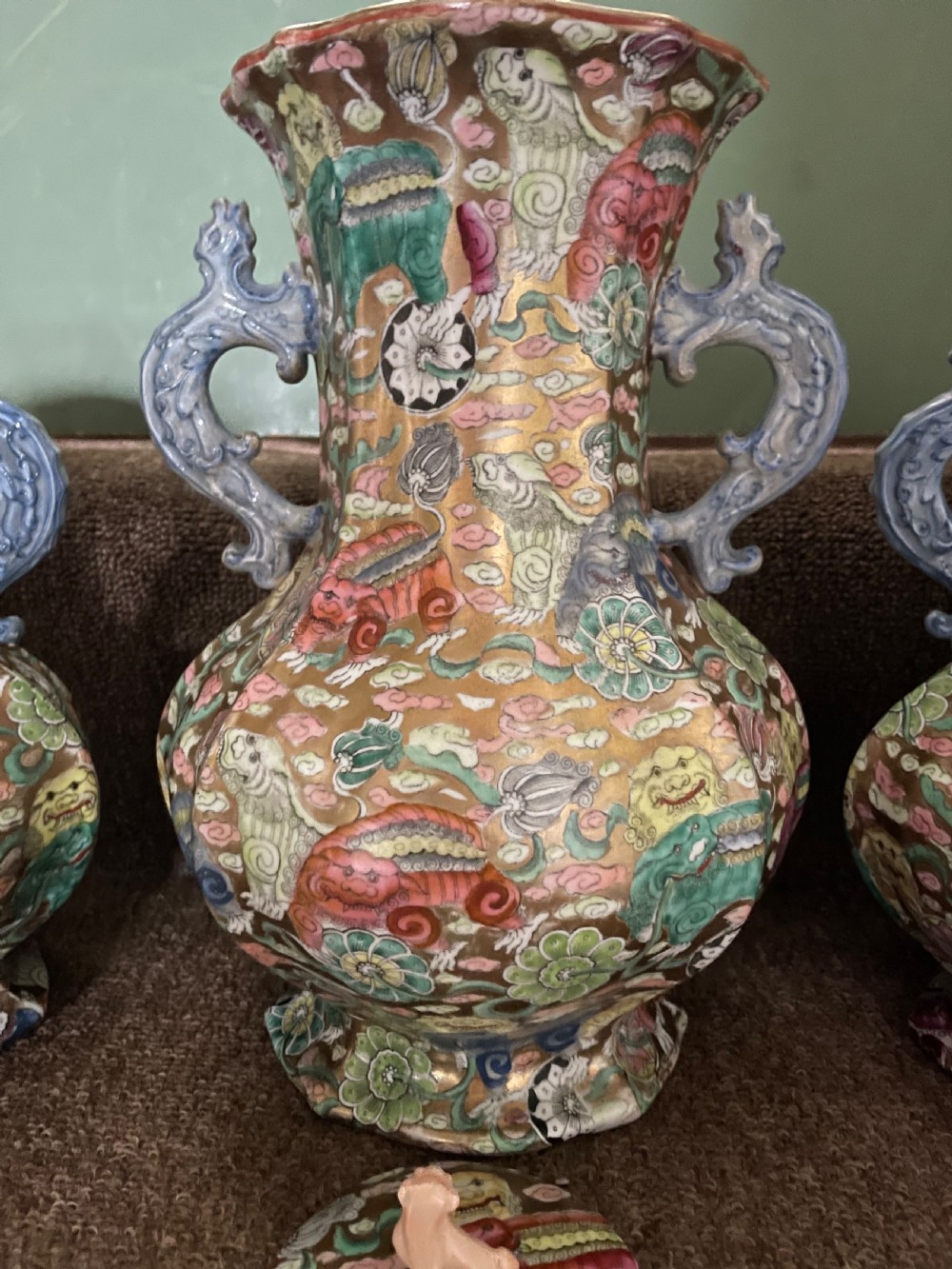 A three-piece nineteenth-century Masons Ironstone garniture set decorated with Chinoiserie enamel patterns, blue handles, and lion lid finials. View IX