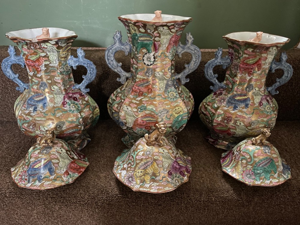 A three-piece nineteenth-century Masons Ironstone garniture set decorated with Chinoiserie enamel patterns, blue handles, and lion lid finials. View XIII