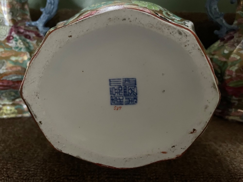 A three-piece nineteenth-century Masons Ironstone garniture set decorated with Chinoiserie enamel patterns, blue handles, and lion lid finials. View XVII