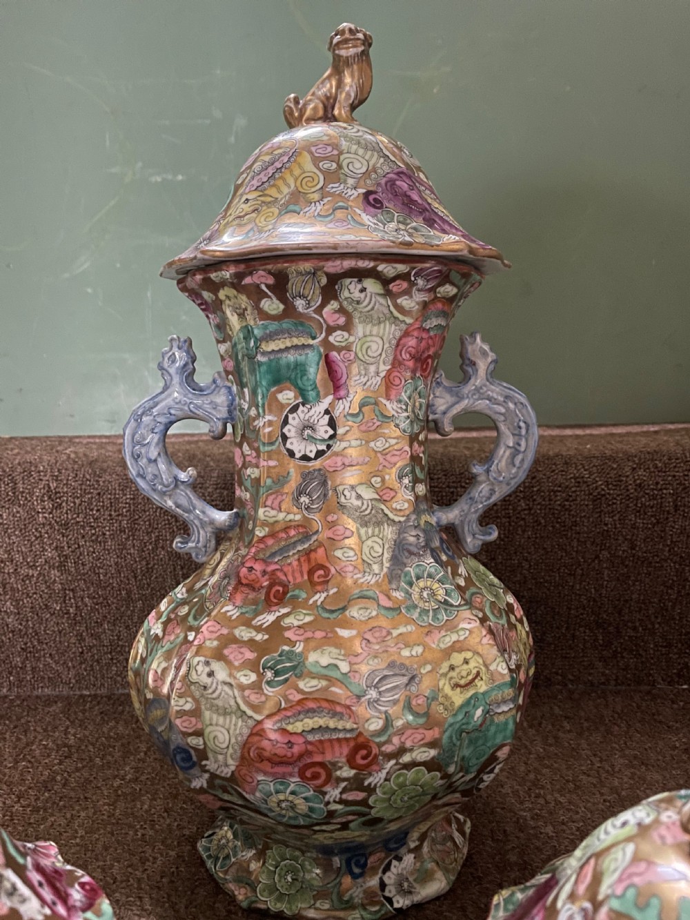 A three-piece nineteenth-century Masons Ironstone garniture set decorated with Chinoiserie enamel patterns, blue handles, and lion lid finials. View XXI