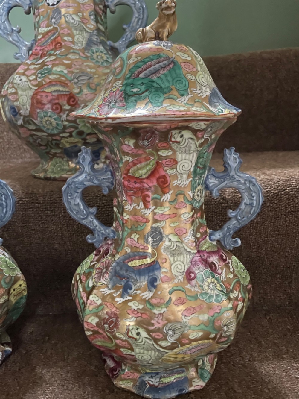 A three-piece nineteenth-century Masons Ironstone garniture set decorated with Chinoiserie enamel patterns, blue handles, and lion lid finials. View XXIII