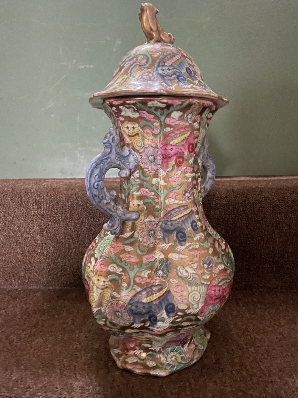 A three-piece nineteenth-century Masons Ironstone garniture set decorated with Chinoiserie enamel patterns, blue handles, and lion lid finials. View XXVI