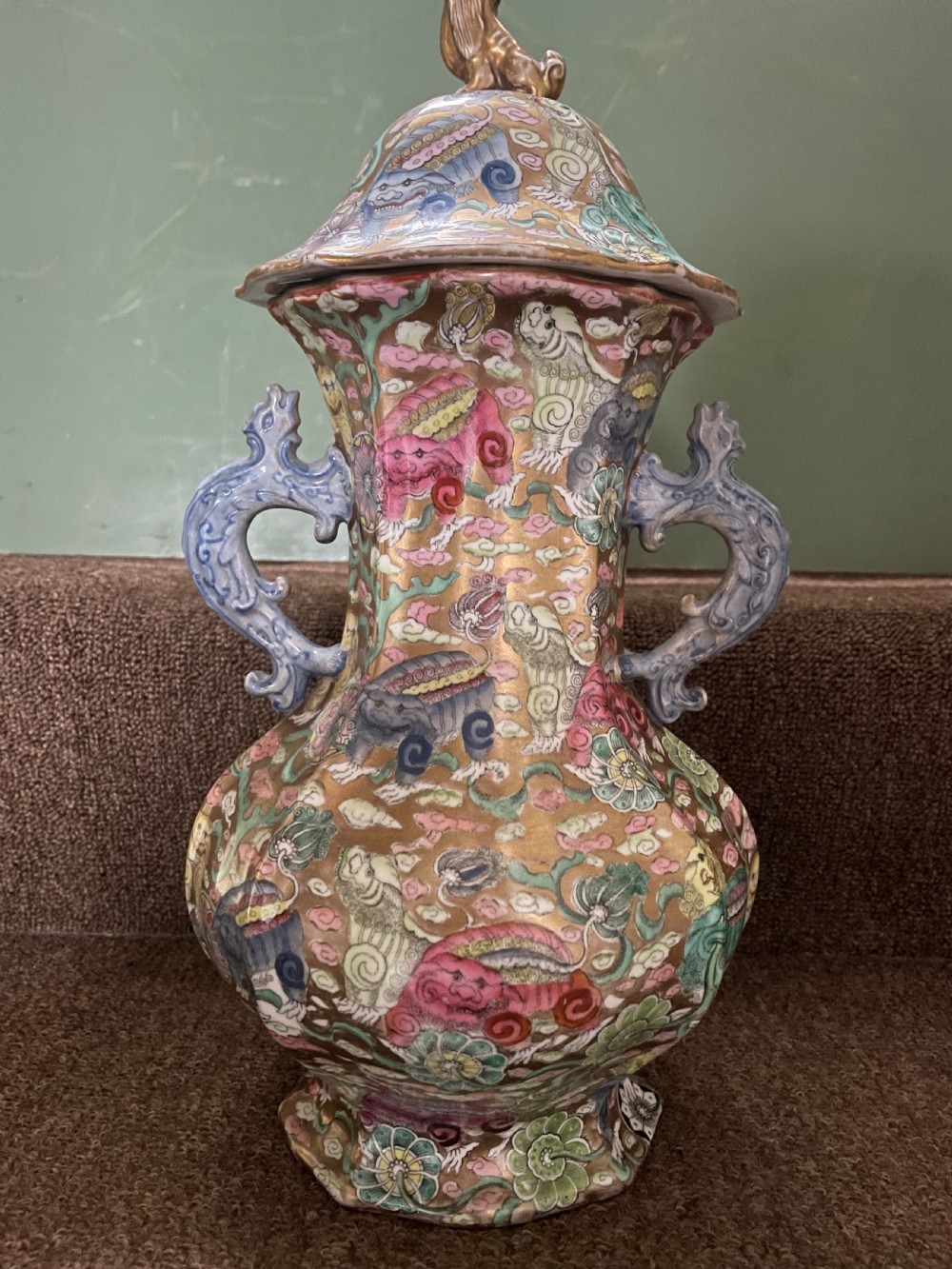 A three-piece nineteenth-century Masons Ironstone garniture set decorated with Chinoiserie enamel patterns, blue handles, and lion lid finials. View XXVII