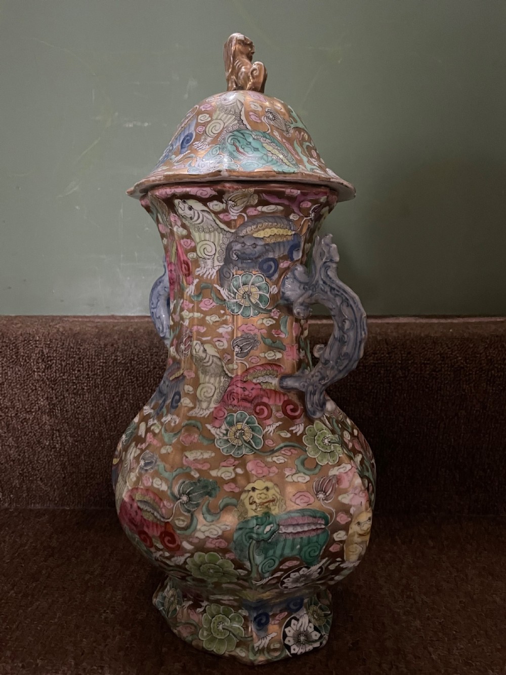 A three-piece nineteenth-century Masons Ironstone garniture set decorated with Chinoiserie enamel patterns, blue handles, and lion lid finials. View XXVIII
