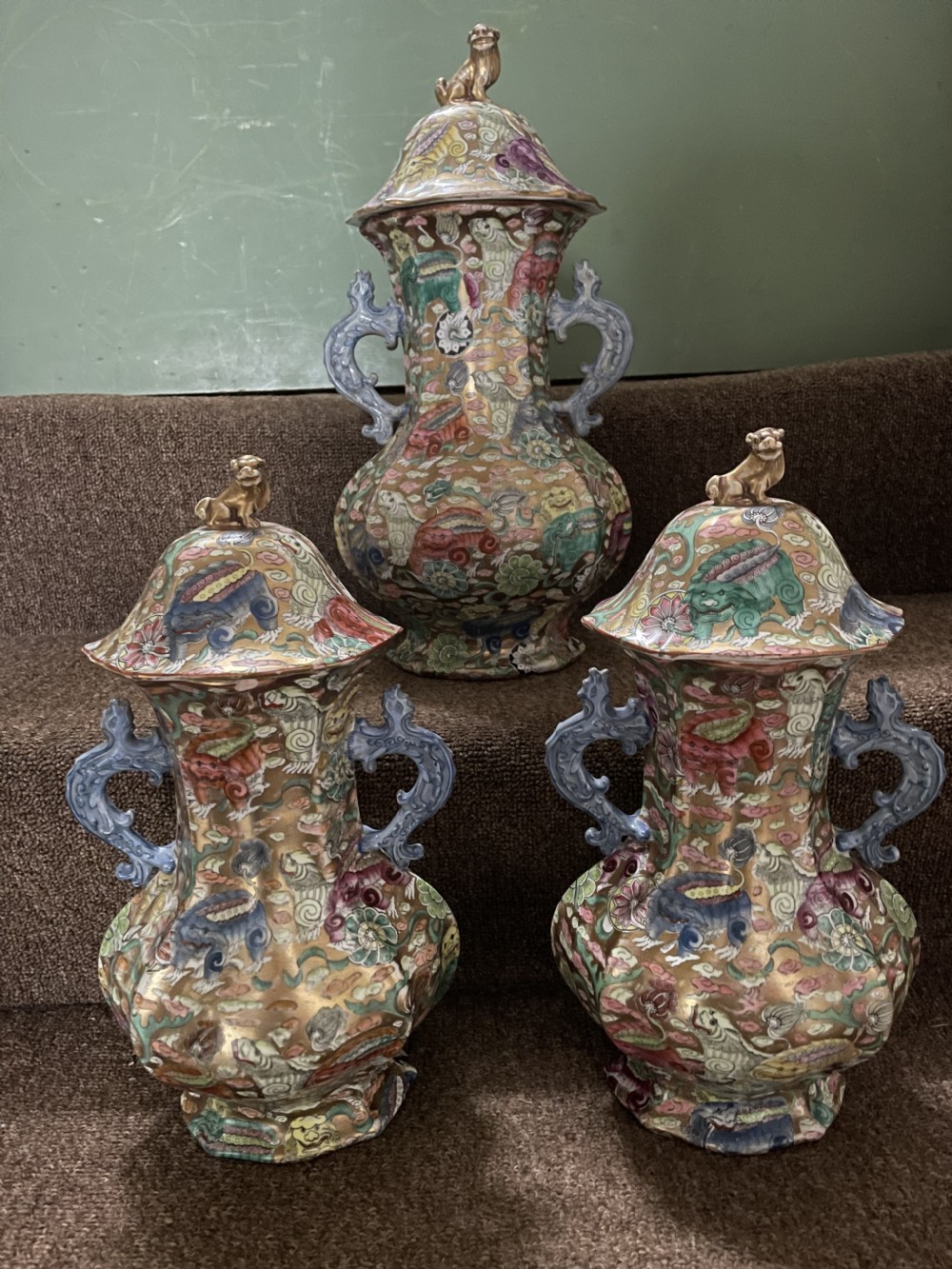 A three-piece nineteenth-century Masons Ironstone garniture set decorated with Chinoiserie enamel patterns, blue handles, and lion lid finials. View XXIX