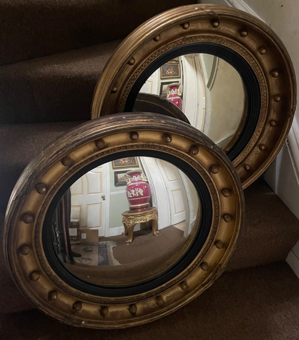 Matched pair of early C19th Regency period circular gilt-wood framed convex-plate mirrors  View III