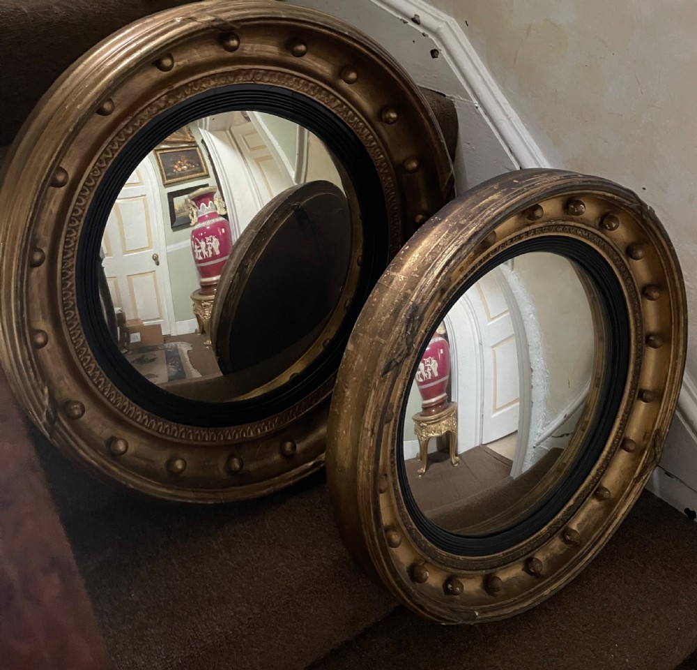 Matched pair of early C19th Regency period circular gilt-wood framed convex-plate mirrors  View V