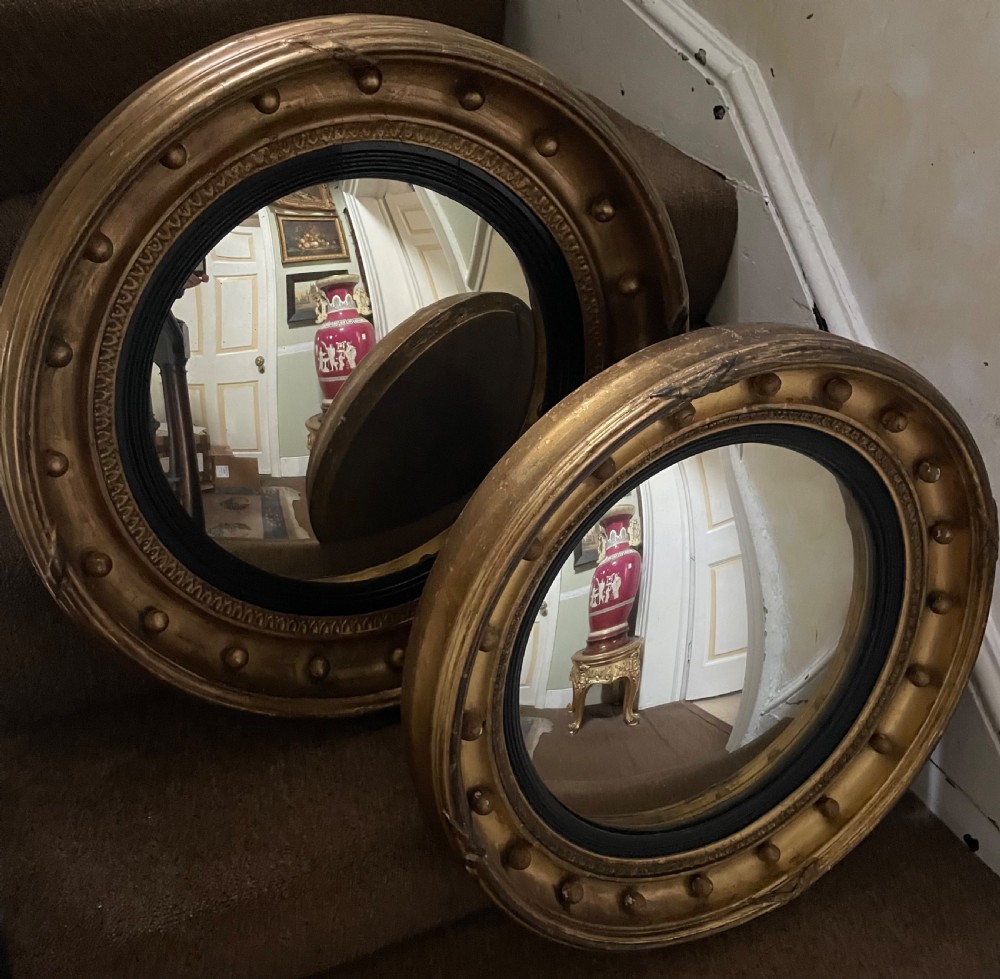 Matched pair of early C19th Regency period circular gilt-wood framed convex-plate mirrors  View VIII