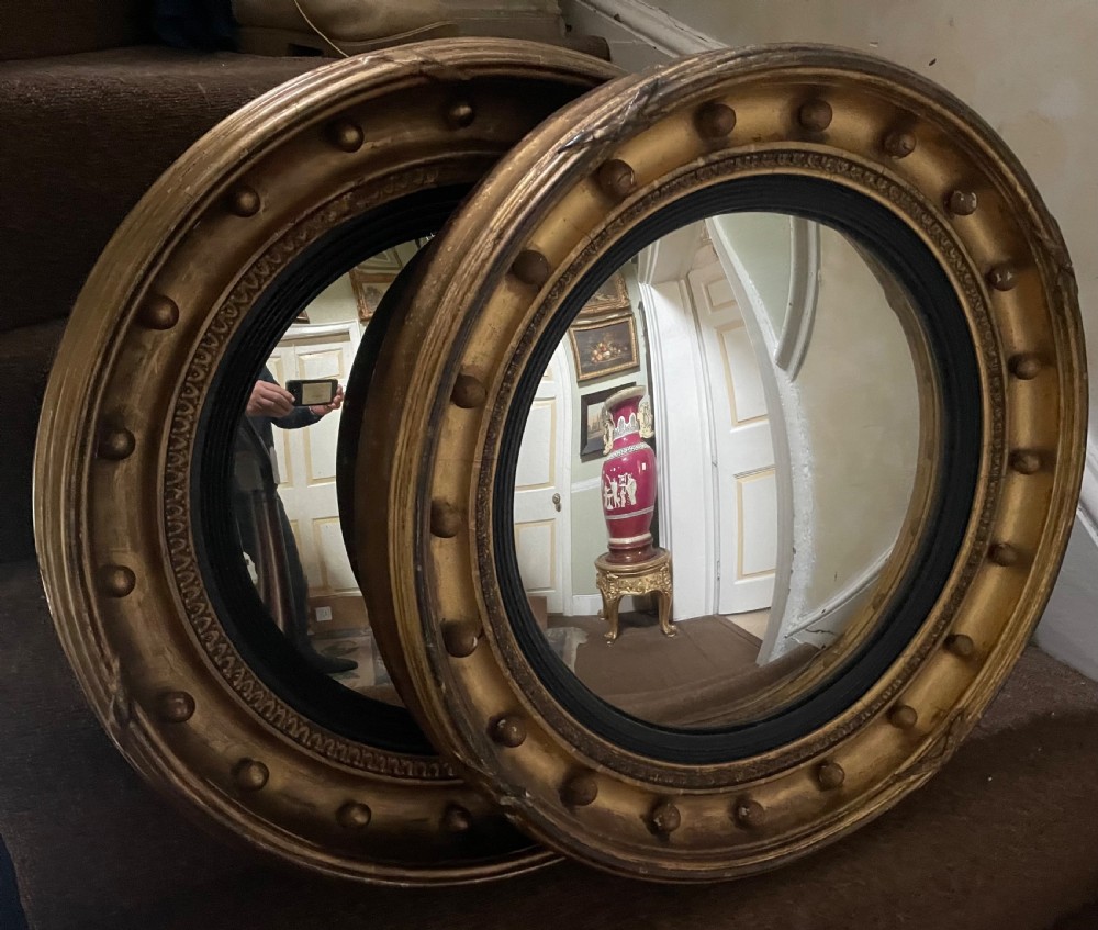 Matched pair of early C19th Regency period circular gilt-wood framed convex-plate mirrors  View IX