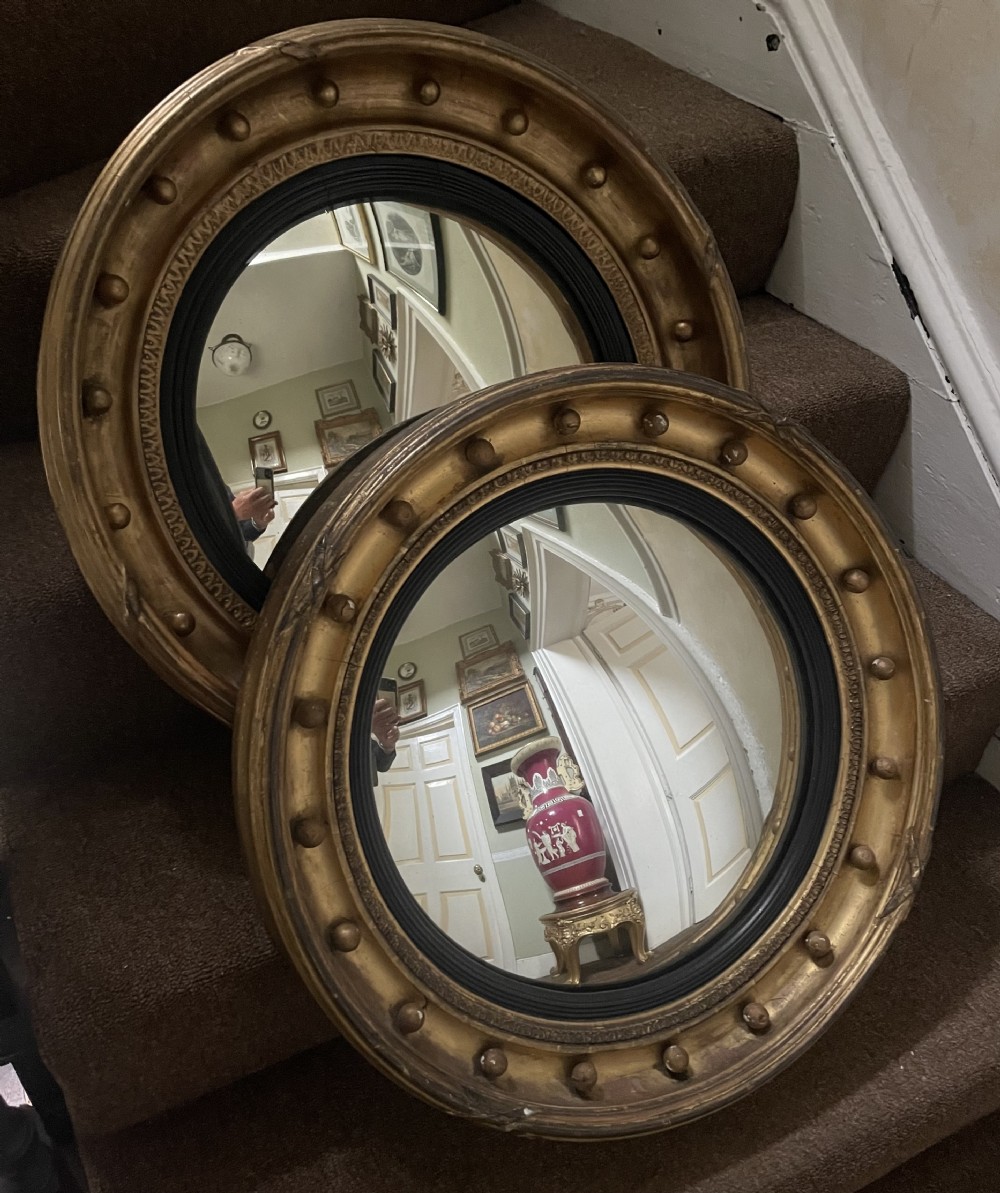 Matched pair of early C19th Regency period circular gilt-wood framed convex-plate mirrors  View XVI