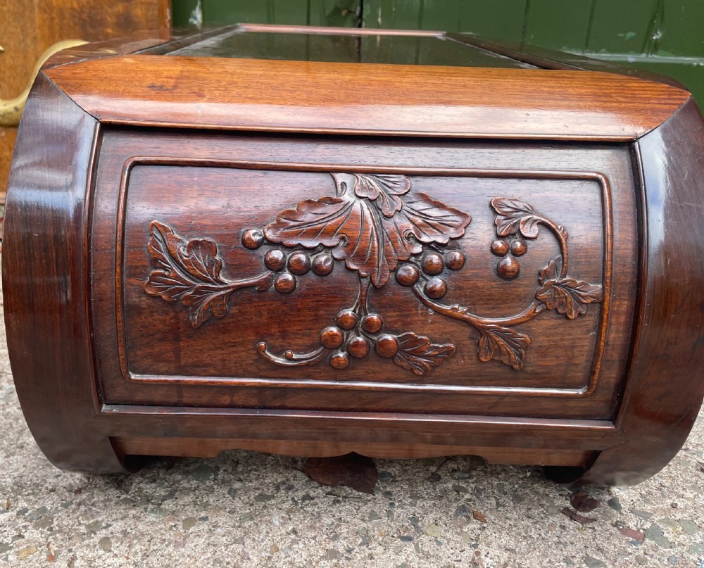 A low Chinese huali wood kang table featuring an openwork carved apron and scroll-end legs. View VIII