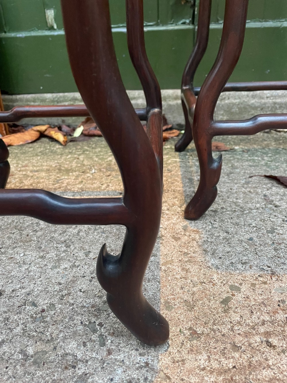 A pair of tall late 19th-century Chinese Qing Dynasty dark hardwood stands featuring square tops, openwork carved scroll aprons, and slender serpentine legs. View XIV