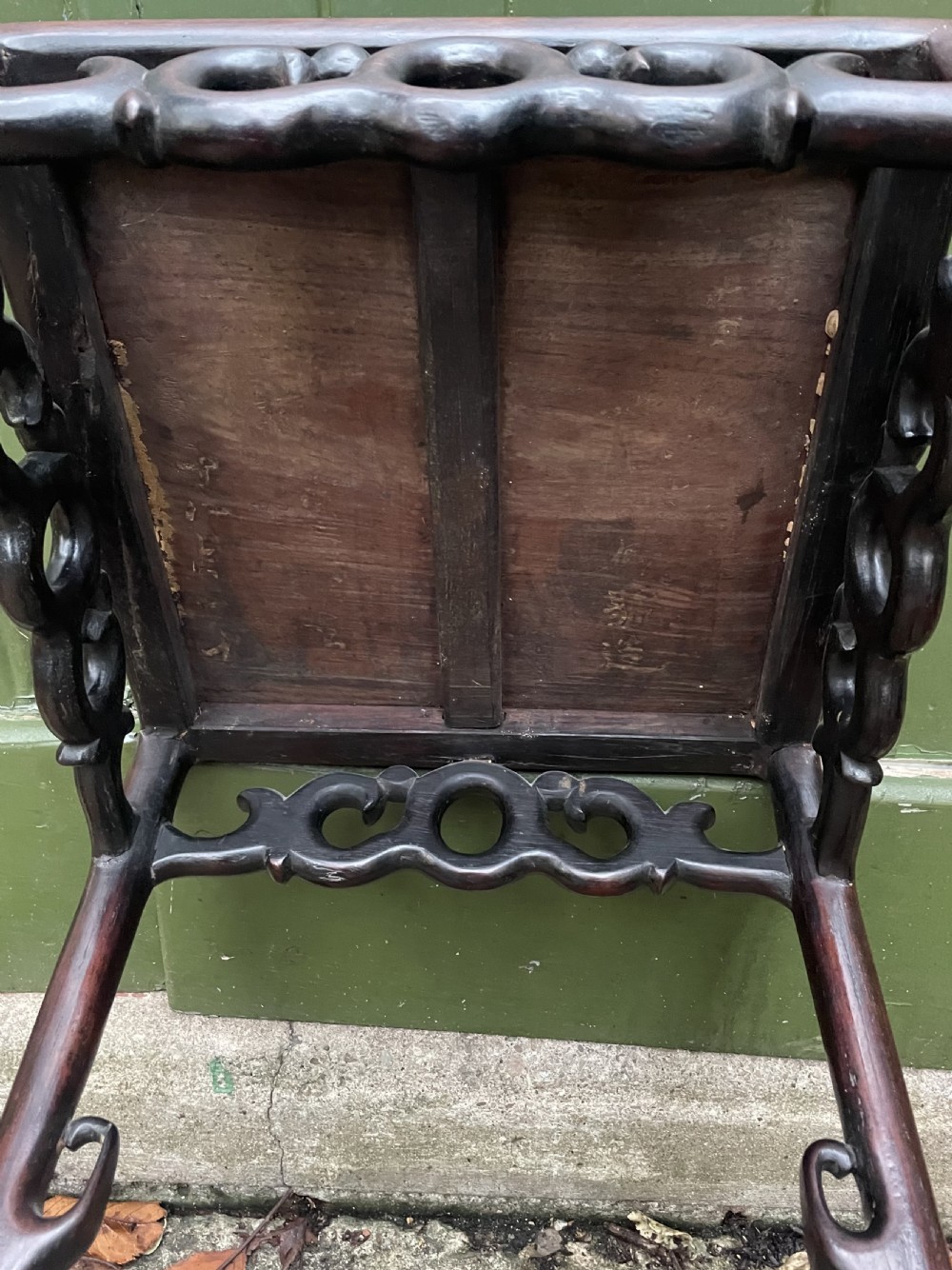 A pair of tall late 19th-century Chinese Qing Dynasty dark hardwood stands featuring square tops, openwork carved scroll aprons, and slender serpentine legs. View XXVI