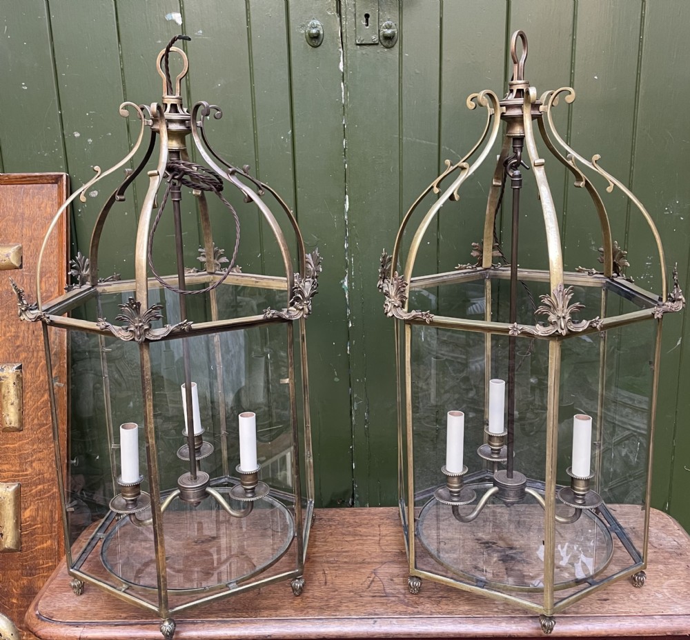 Pair of early C20th brass-framed hexagonal hall lanterns of late C18th George III period design.