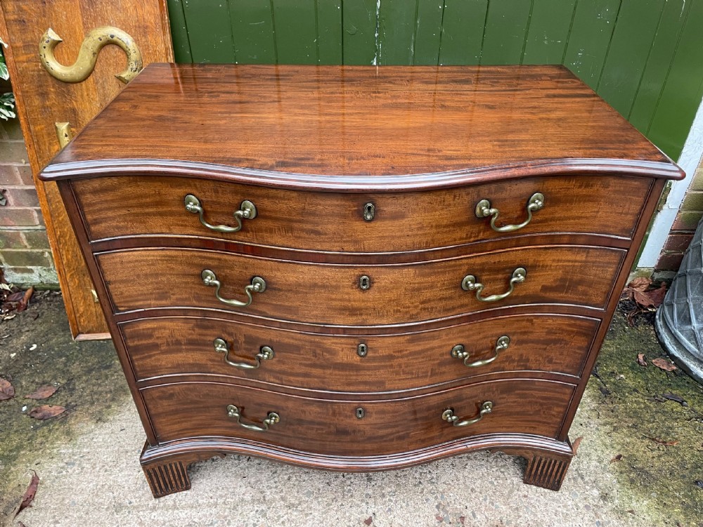 Fine C18th George III Chippendale period mahogany serpentine-front chest of drawers.  View II
