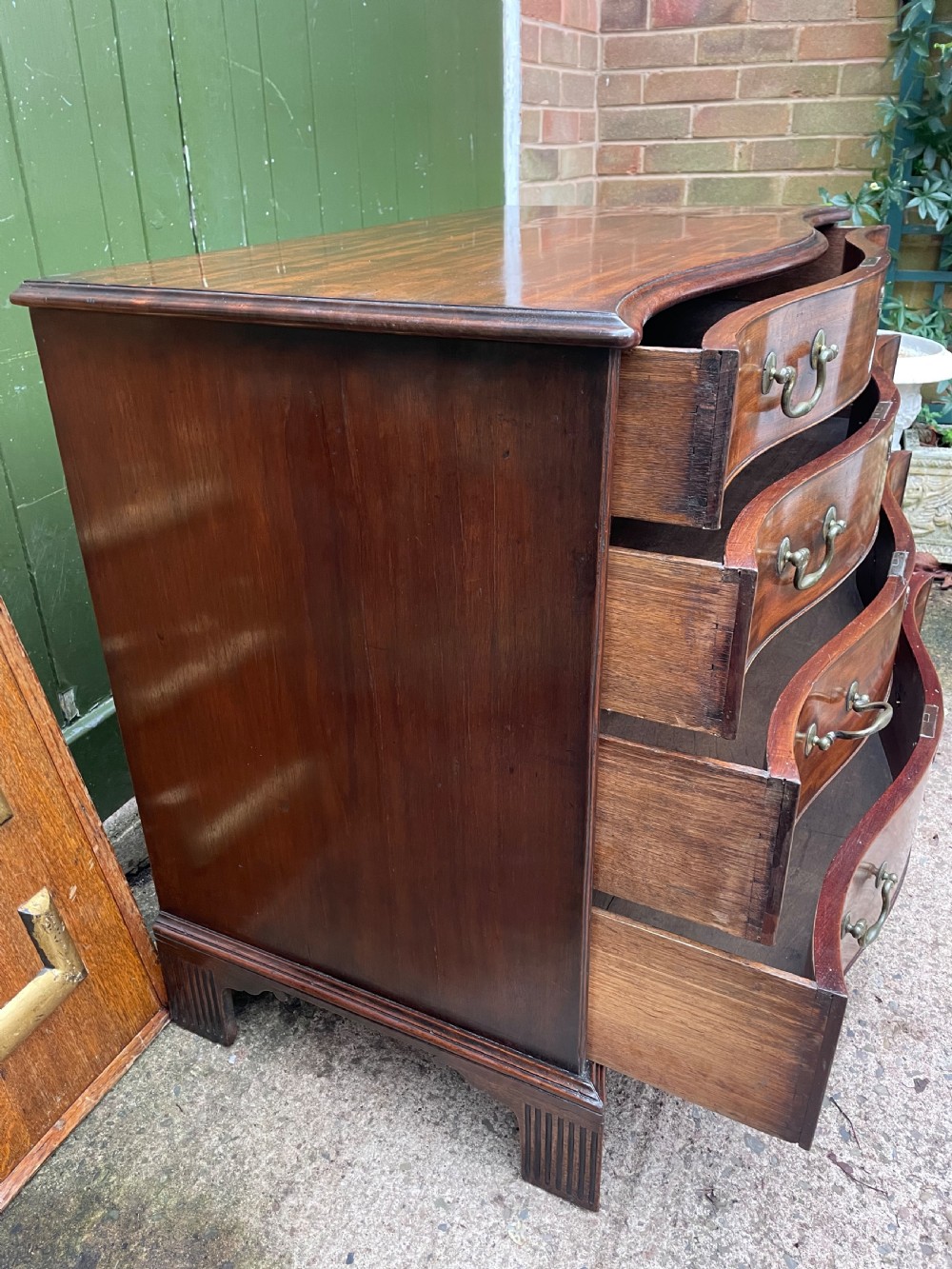 Fine C18th George III Chippendale period mahogany serpentine-front chest of drawers.  View VI