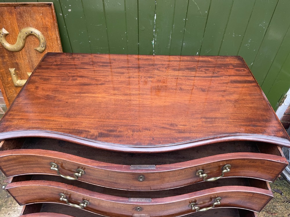 Fine C18th George III Chippendale period mahogany serpentine-front chest of drawers.  View IX