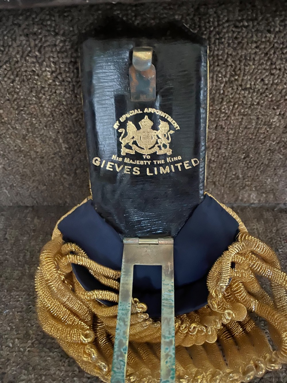 Early C20th British Royal Naval officer’s ceremonial dress bicorn hat , gold braided epaulettes and sword belt by Gieves, London. View IV