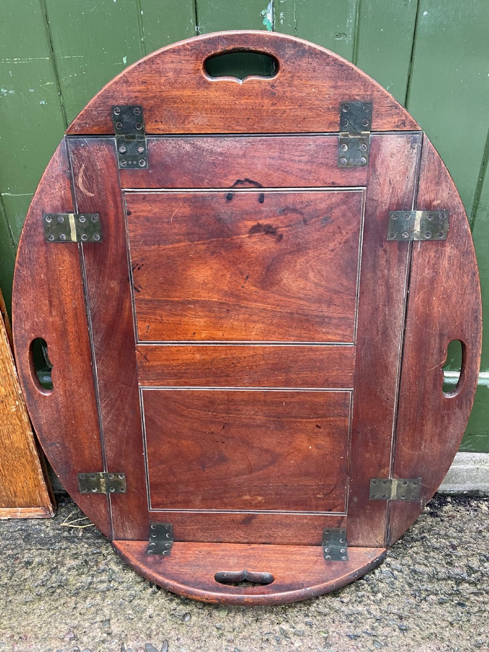 Late C18th George III period mahogany oval ‘butler’s’ tray with brass hinged folding sides .