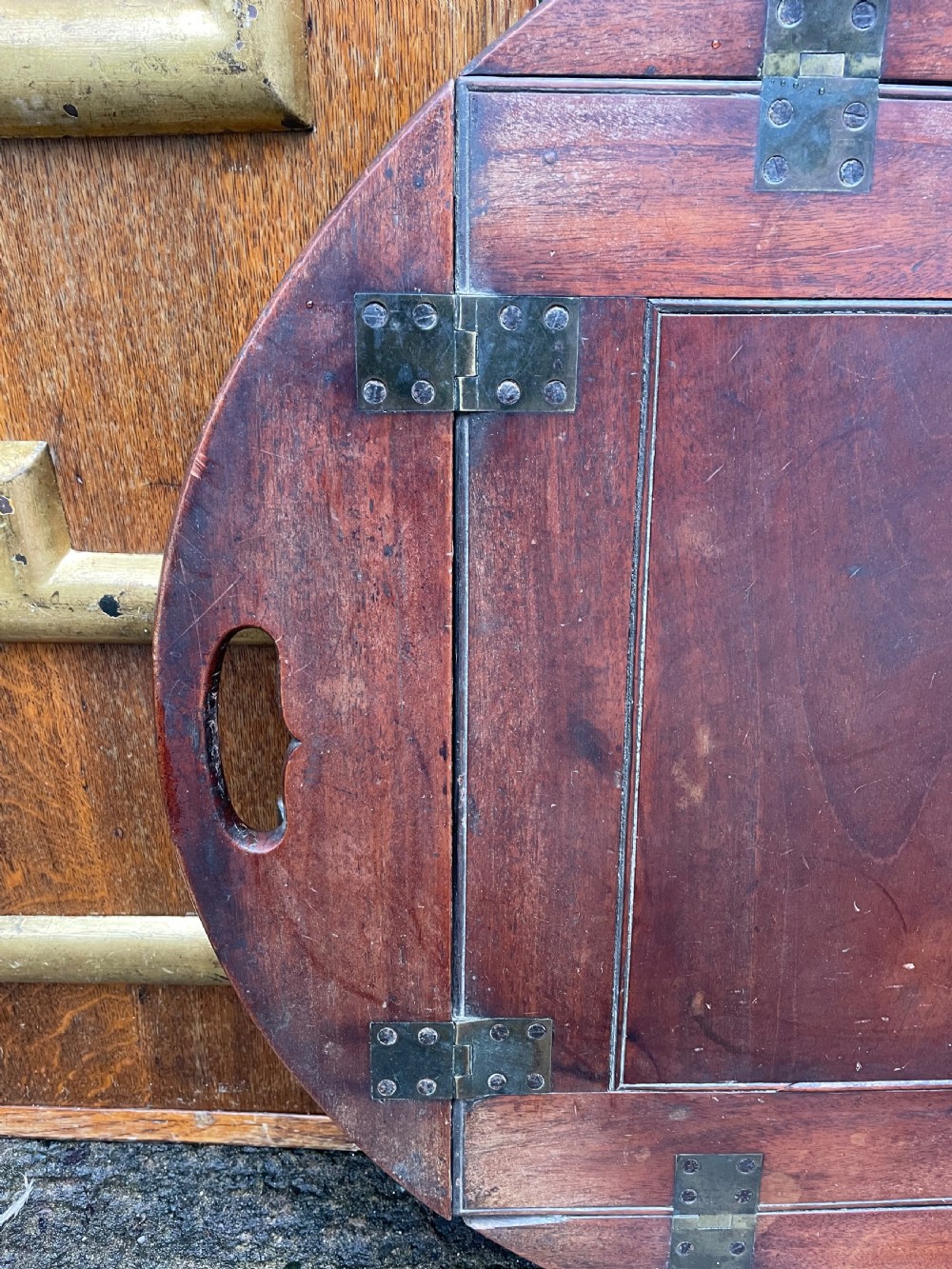 Late C18th George III period mahogany oval ‘butler’s’ tray with brass hinged folding sides . View IV