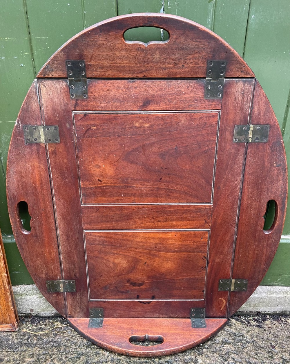 Late C18th George III period mahogany oval ‘butler’s’ tray with brass hinged folding sides . View X