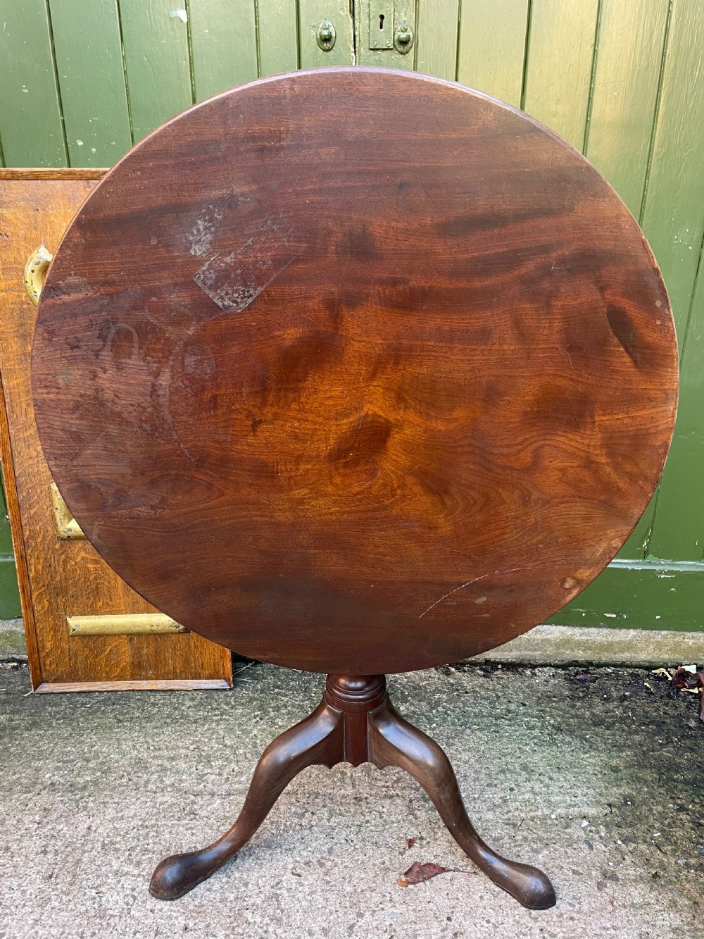 C18th George III period mahogany circular ‘snap-top’ tripod base tea table on carved pillar column. 