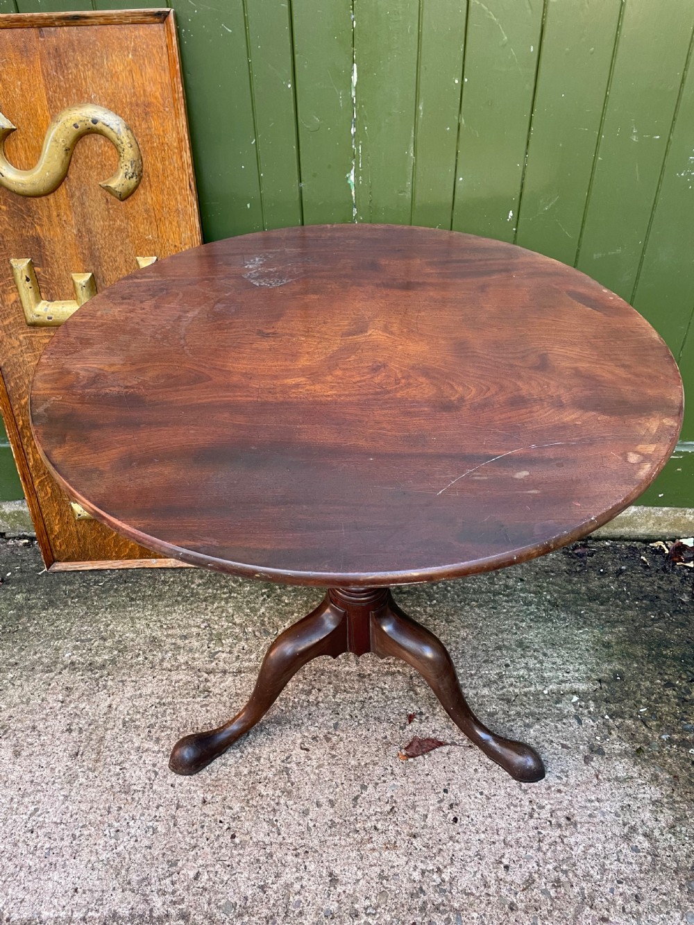 C18th George III period mahogany circular ‘snap-top’ tripod base tea table on carved pillar column.  View IV