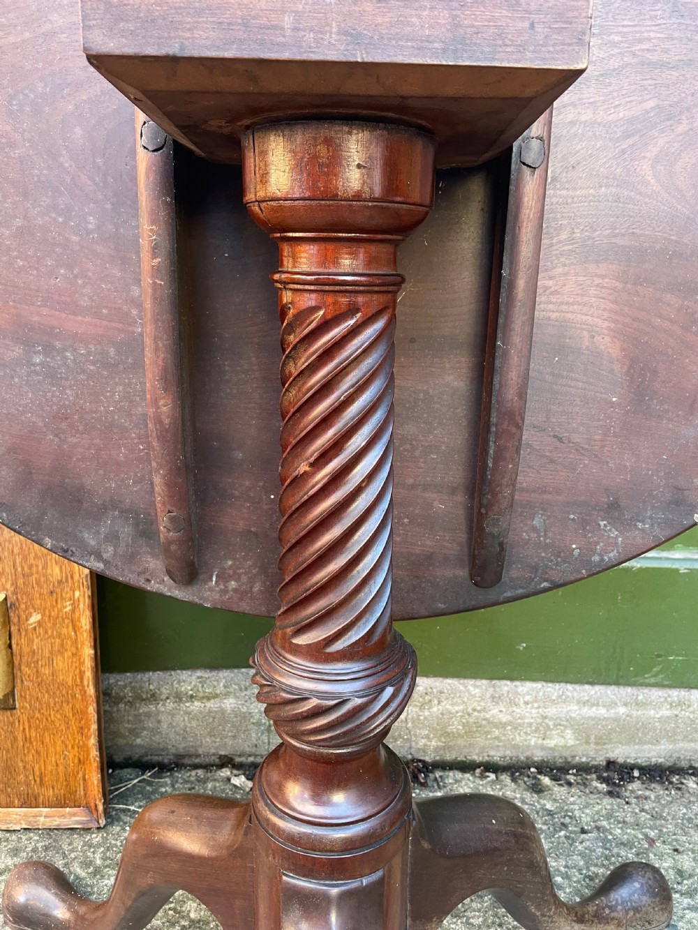 C18th George III period mahogany circular ‘snap-top’ tripod base tea table on carved pillar column.  View VII