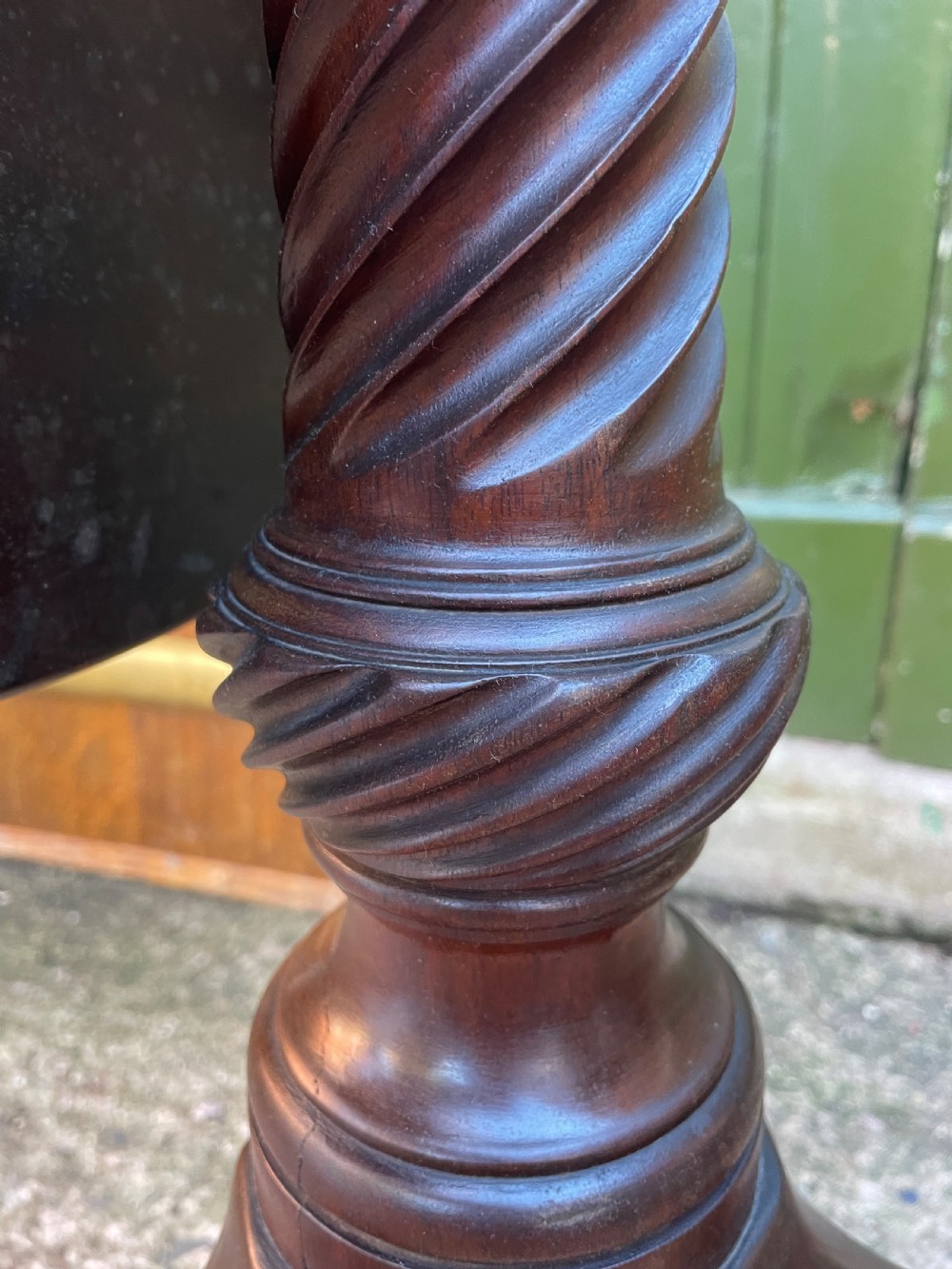 C18th George III period mahogany circular ‘snap-top’ tripod base tea table on carved pillar column.  View XI