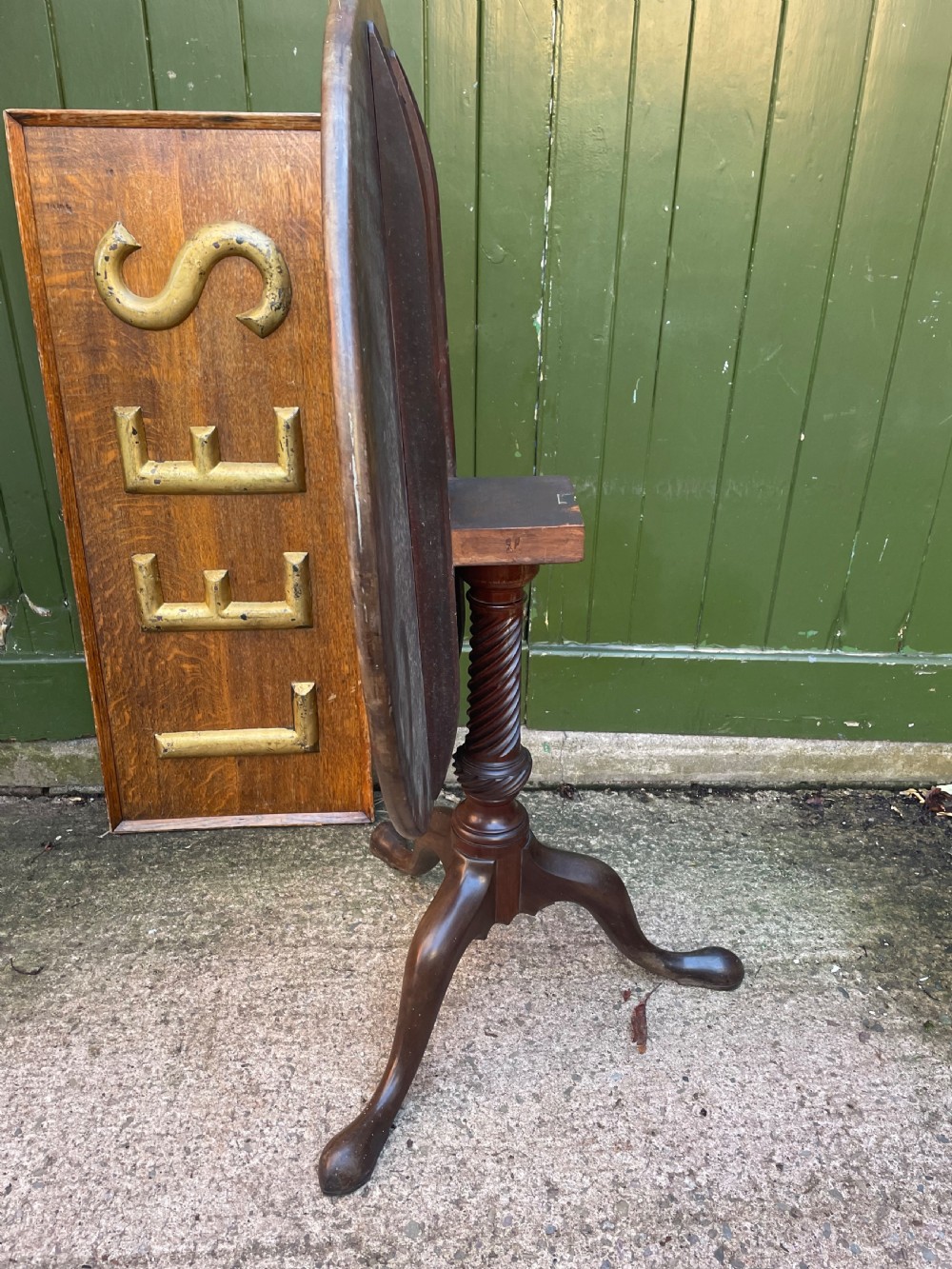 C18th George III period mahogany circular ‘snap-top’ tripod base tea table on carved pillar column.  View XII